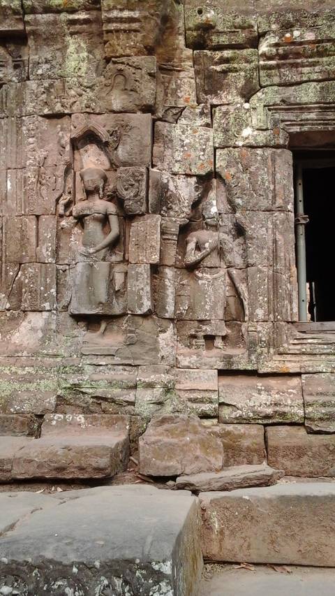       Close-up of carvings on ancient temple walls.
  