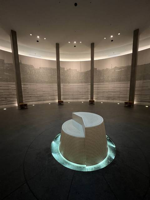       An exhibition room with modern architectural design.
  