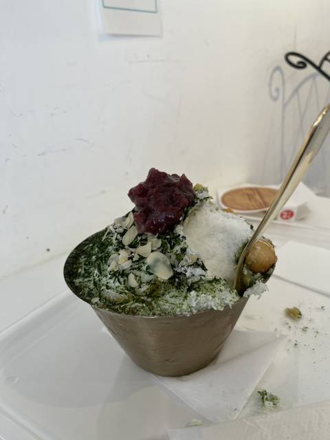       Traditional Japanese dessert with red bean and tea garnishes.
  