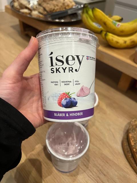       Person holding a container of Icelandic Skyr yogurt.
  
