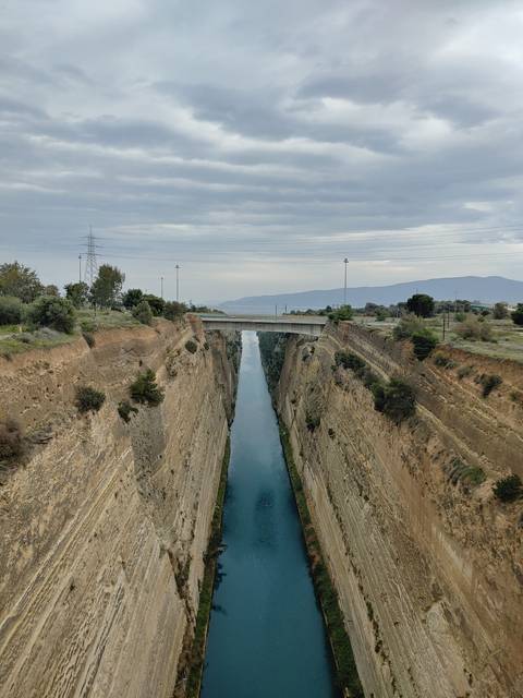       Narrow waterway with cloudy skies.
  