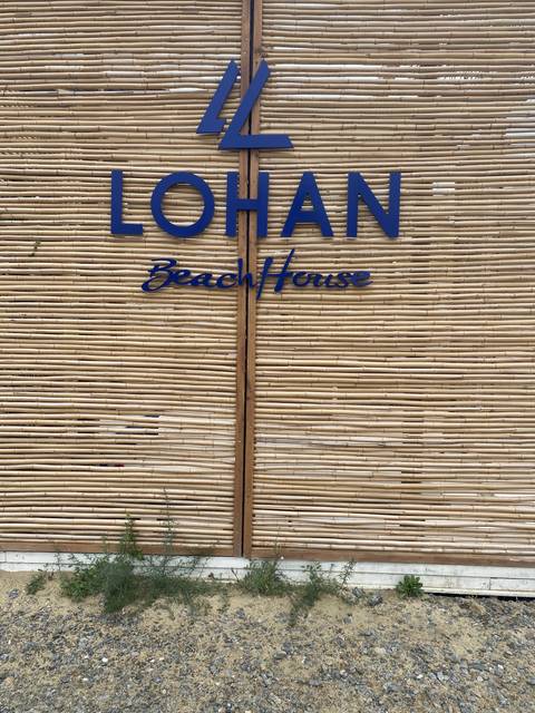       Sign for Lohan Beach House.
  