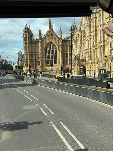 A view of a large historical building in a city setting.