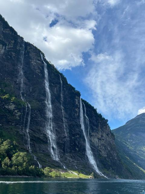       Majestic mountain with cascading waterfalls.
  