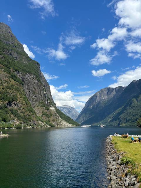       Fiord with a picturesque mountainous backdrop.
  