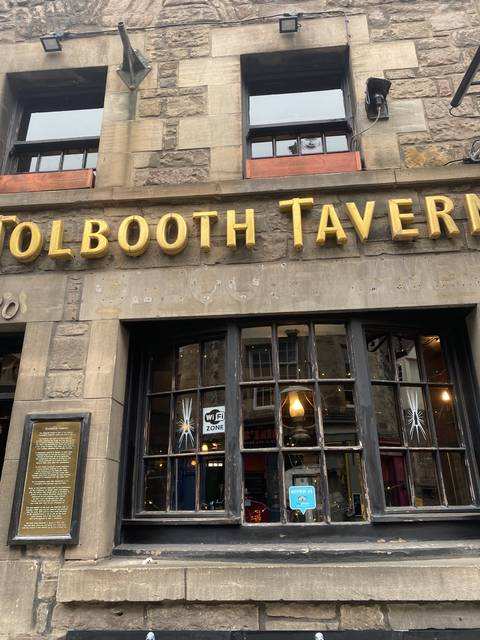       Tavern facade with signage.
  