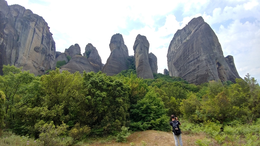       Dramatic rock formations with forest below.
  