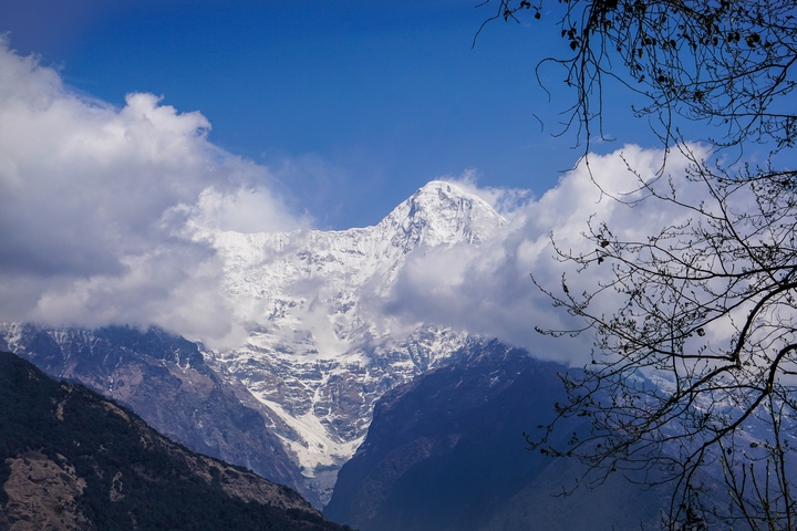       Snow-capped mountains under a clear blue sky.
  