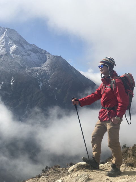 Solo hiker with mountain backdrop