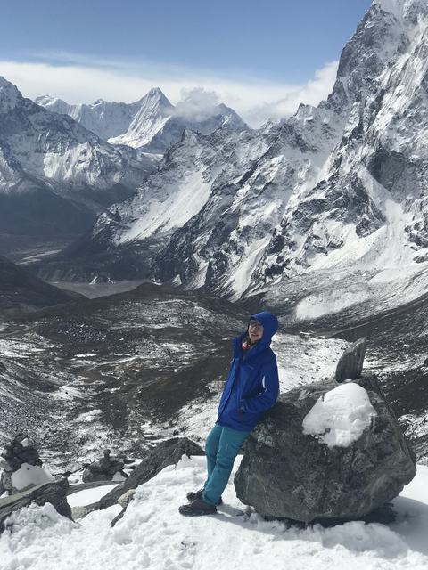 Hiker with snowy peaks in the background