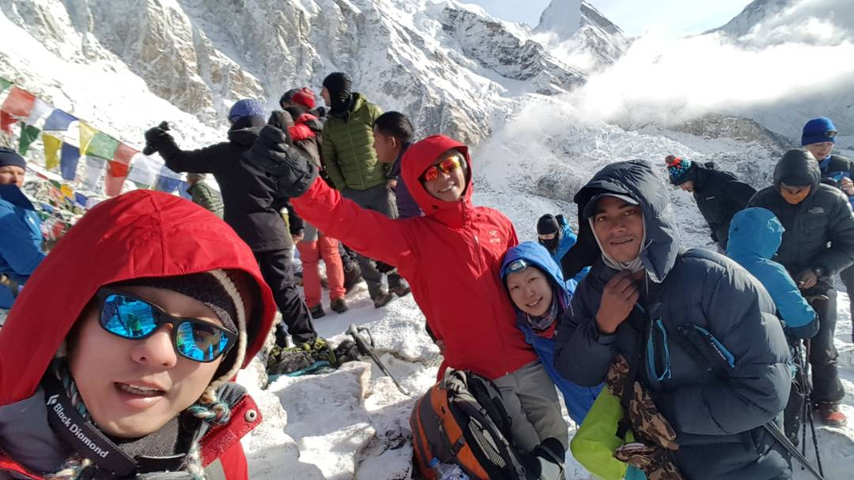 Group of people hiking in snowy mountains