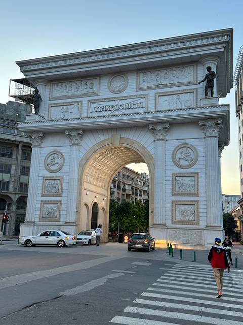 Decorated archway in a city street.