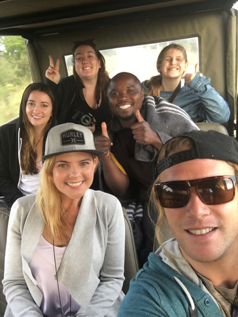 Group of people close-up in a vehicle, slightly blurry.