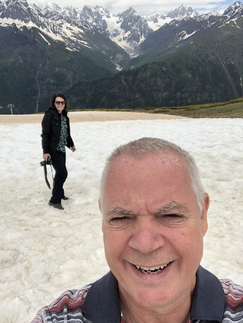       Selfie with two people on snow-covered terrain.
  