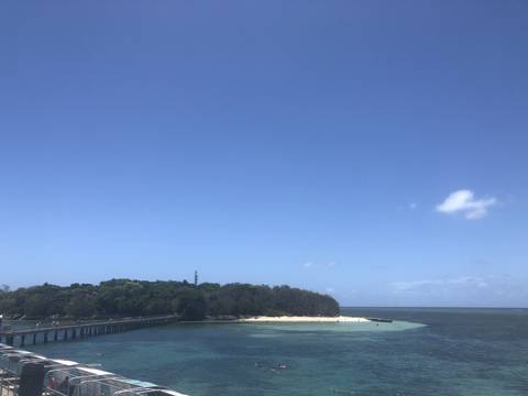       Coastal view with clear blue sky and island
  