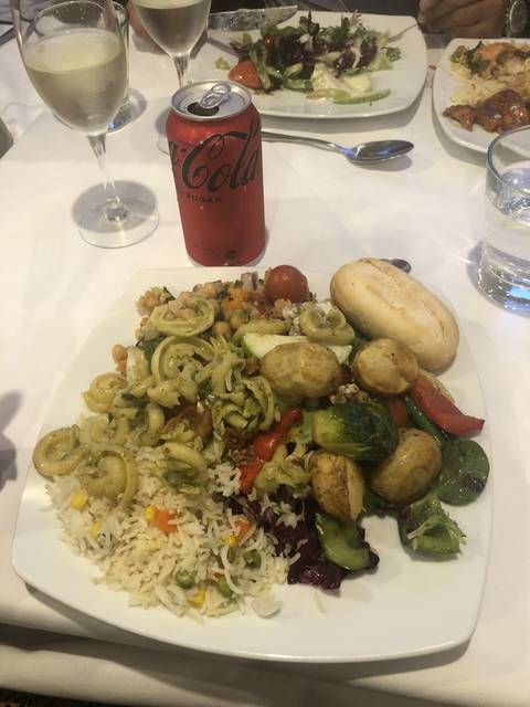 Plate of food with a can of Coke