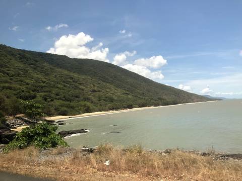       Beach with rocky cliffs and sky
  