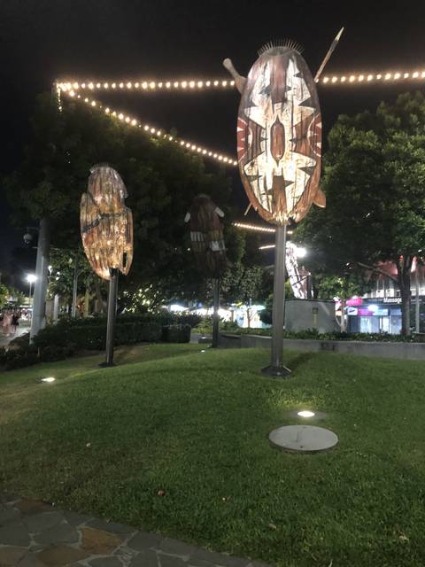       Artistic wooden shields with lighting at night
  