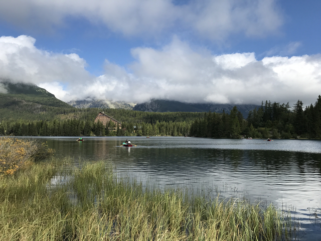 Scenic view of a lake with mountains in the background.