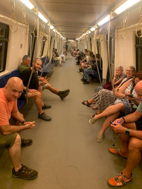 People sitting inside a subway train