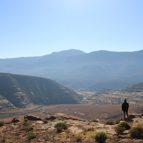 Landscape view of mountains with a small river running through.
