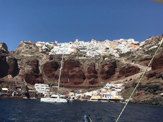 Scenic cliffside village with white houses.