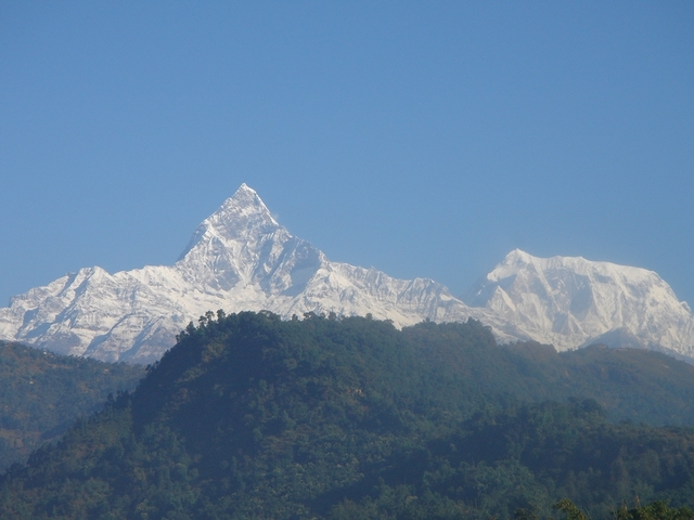 Snow-capped mountains under a clear blue sky.