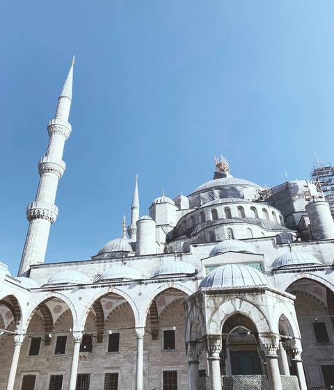       Majestic view of a historic mosque with minarets.
  
