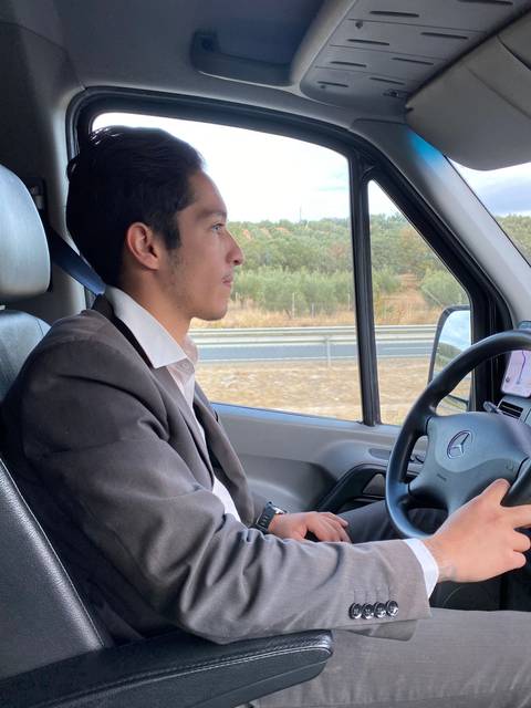 Person driving a vehicle, view from passenger seat