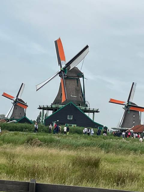 Traditional windmill with colorful blades.