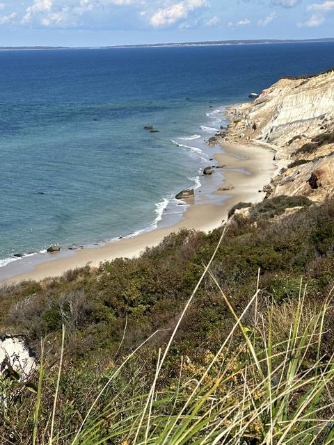 Coastal view with cliffs and ocean waves.