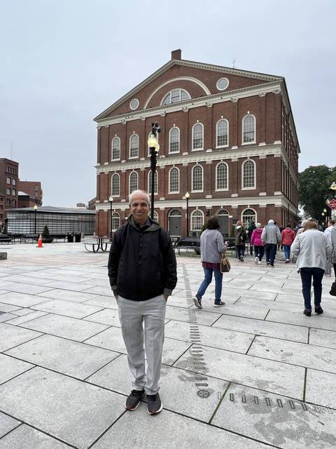 Man standing in front of a historic building.