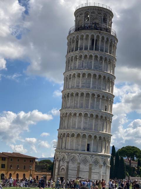 Leaning Tower of Pisa with a crowd of tourists.
