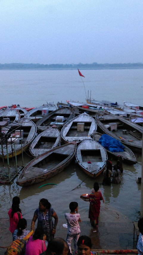 Numerous small boats docked at a waterfront.