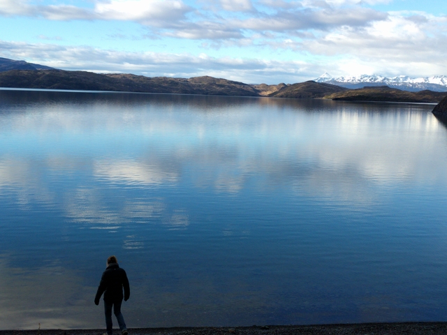       Reflection of mountains and sky in a calm lake.
  