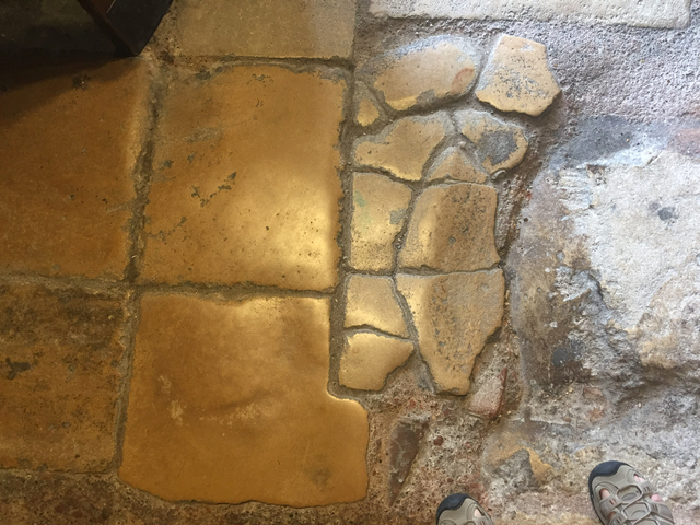 Close-up view of stone and tile floor.