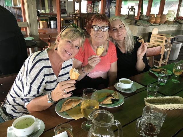 Group of women enjoying a meal at a restaurant.