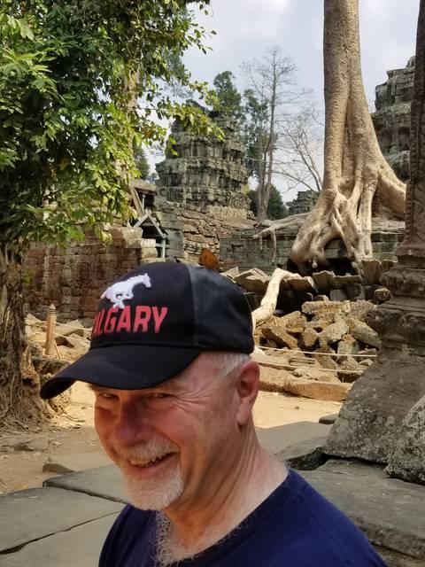 Part of an ancient temple structure with a person's portrait.
