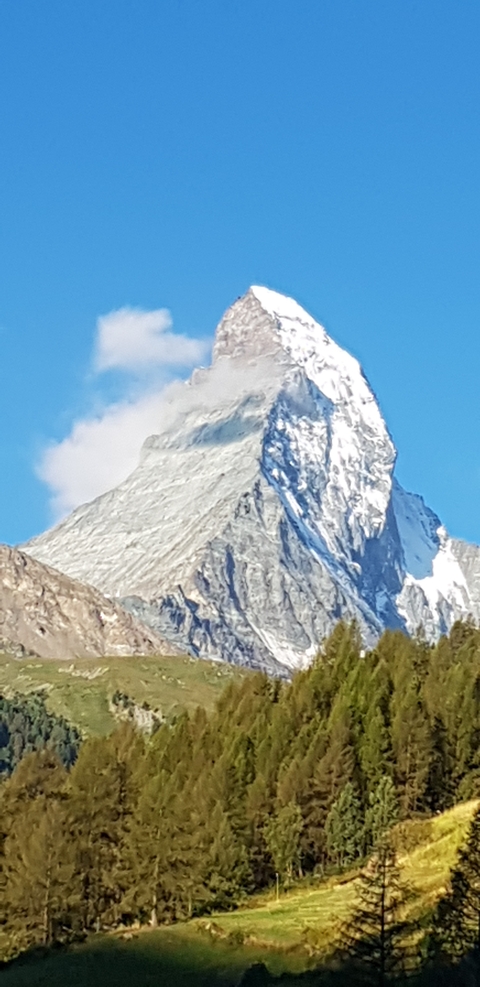Close-up of the Matterhorn peak against a blue sky.
