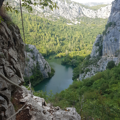 Scenic view of a river between steep rocky cliffs.