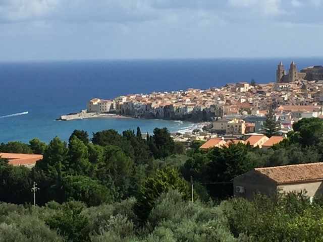 Aerial view of coastal town next to the sea.