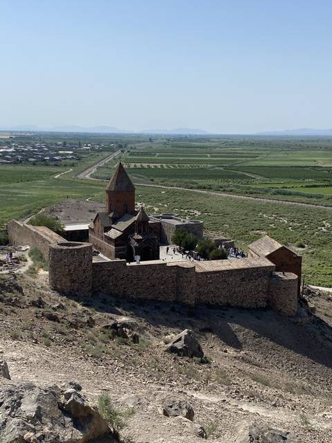 A historic fortress with a landscape view.