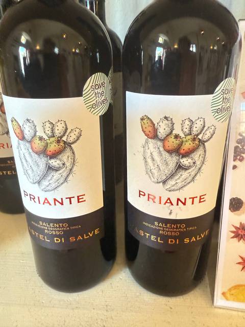       Close-up view of two wine bottles lying horizontally.
  