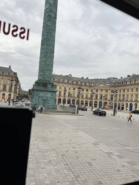       Large square with a column in a European city.
  