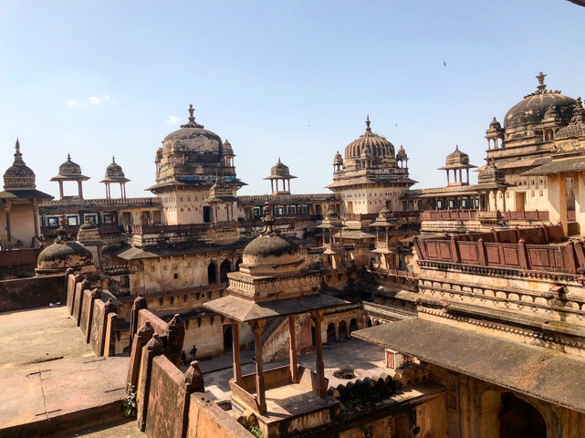 Ancient architectural structure with domes and carvings.