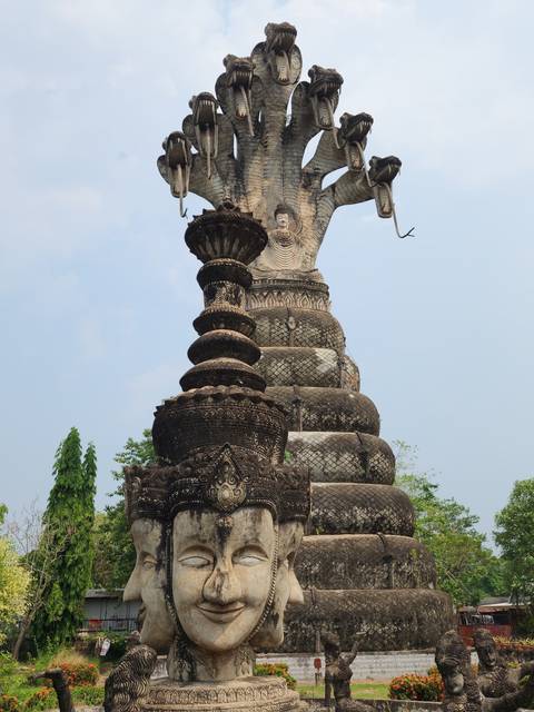 Intricate statue with multiple heads and arms.