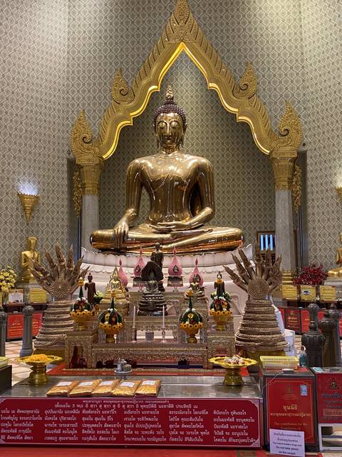 A golden Buddha statue inside a temple.