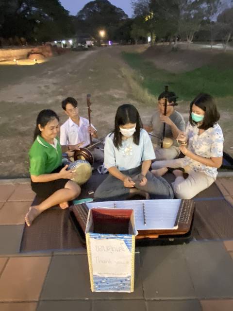 People playing traditional instruments.