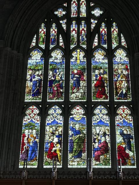      Stained glass window depicting various religious scenes.
  