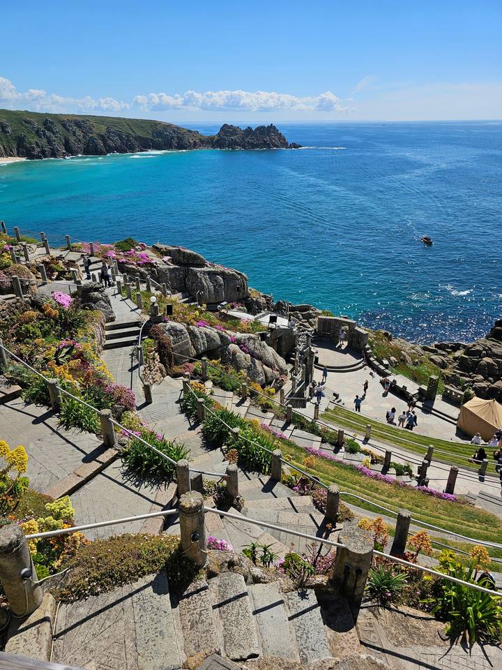 Coastal landscape with rocky cliffs and ocean view.